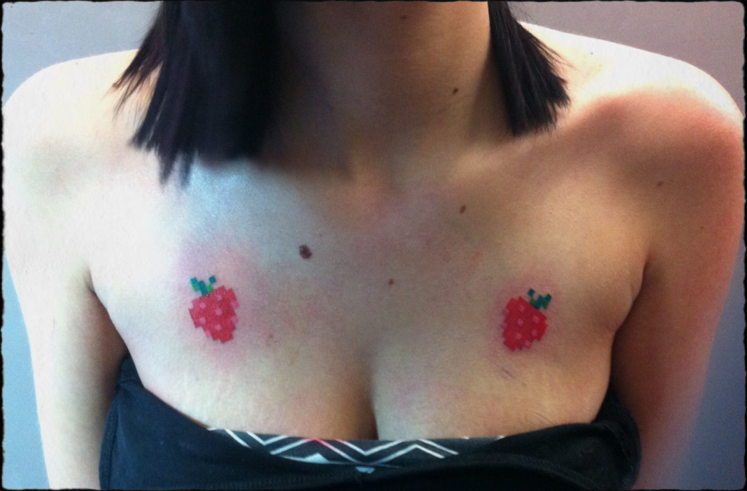 Cross stitch or pixel tattoo of strawberrys