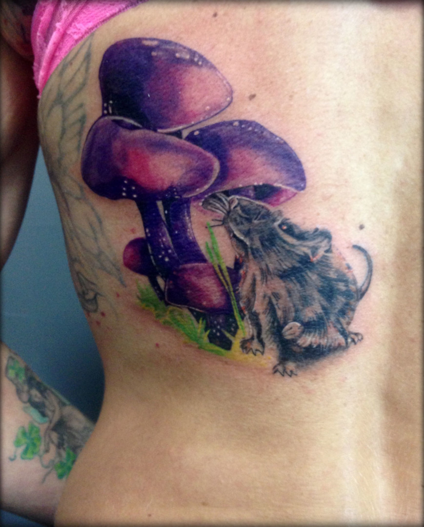 Tattoo of a mouse under a mushroom