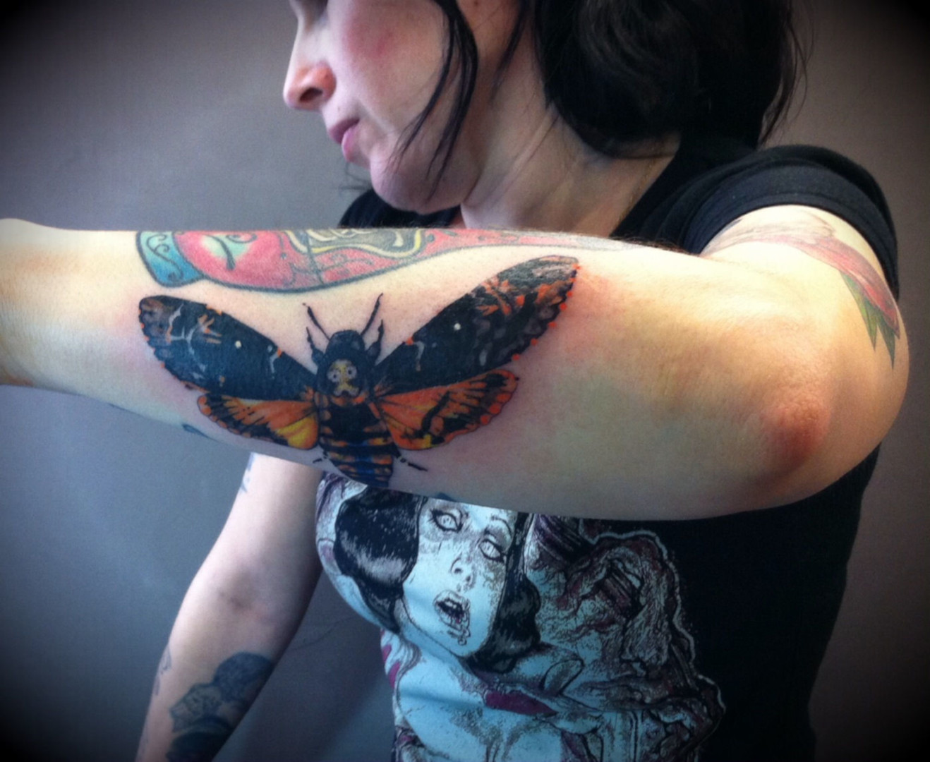 Tattoo of a moth, a night butterfly