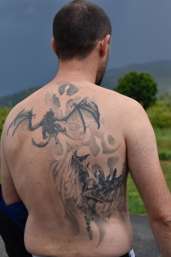 Archangel and dragon back tattoo